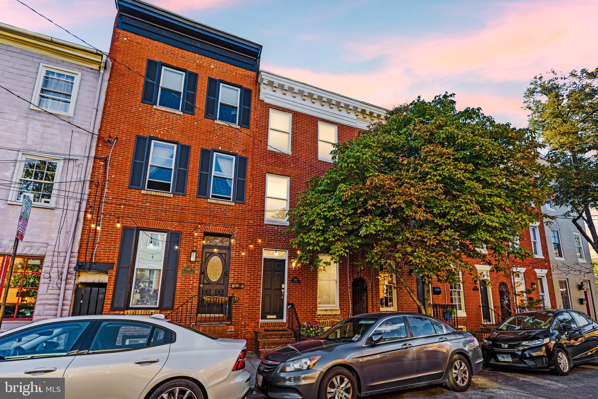 a view of cars parked in front of a building