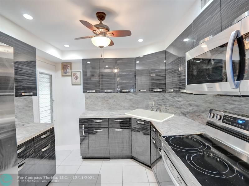 a kitchen with a stove and a sink