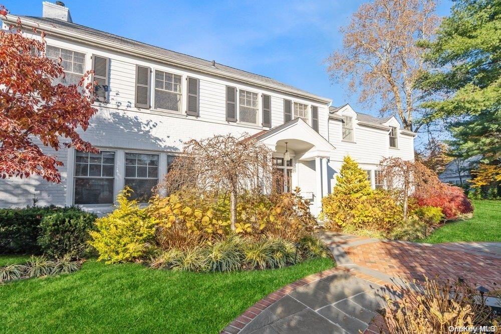 a front view of a house with garden