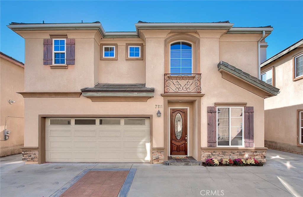 a front view of a house with a garage