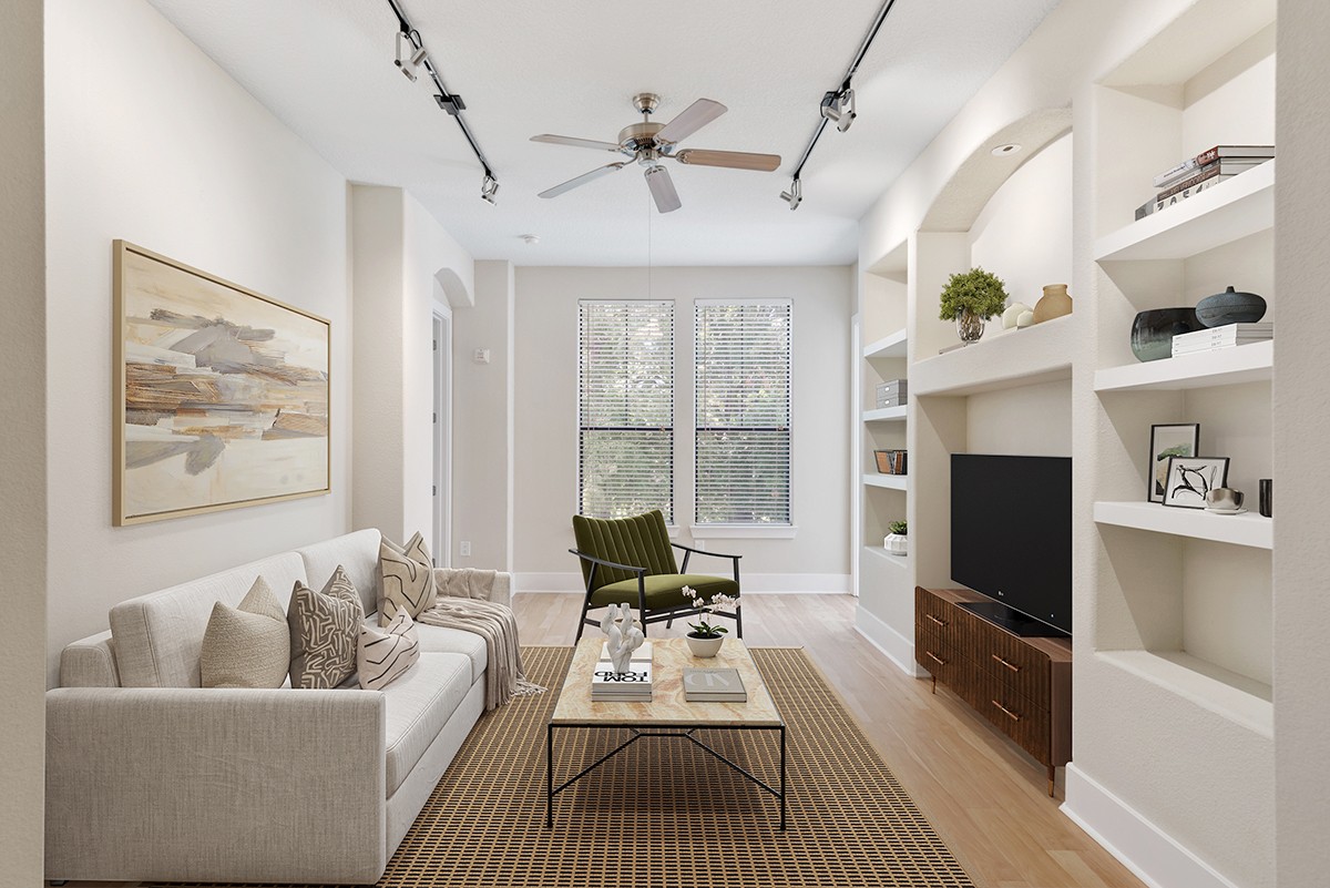 a living room with furniture and a flat screen tv