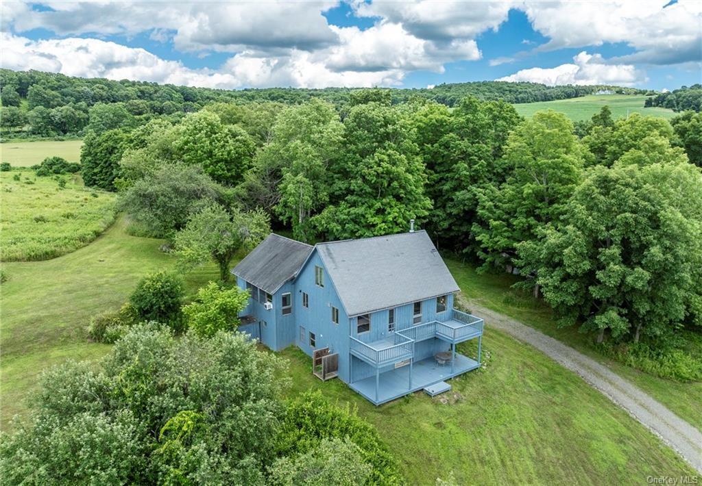 an aerial view of a house with garden