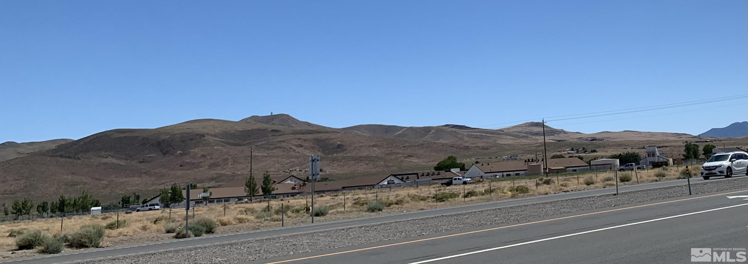 a view of a town with mountains in the background