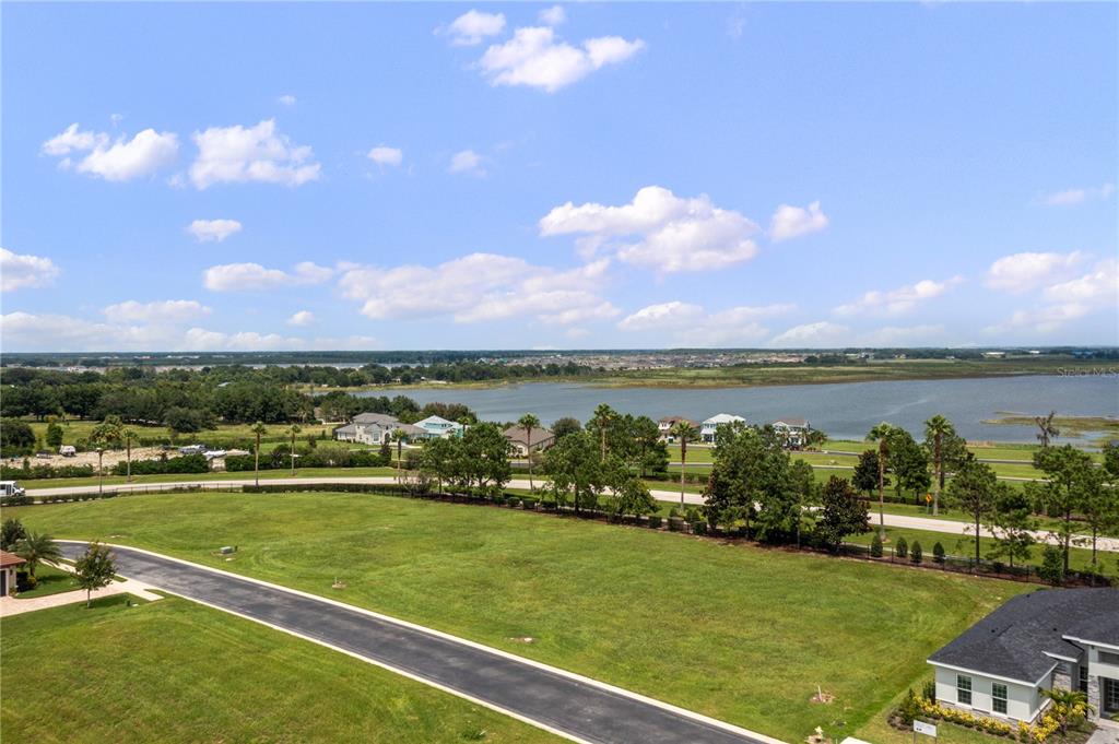 a view of a lake with houses in the back