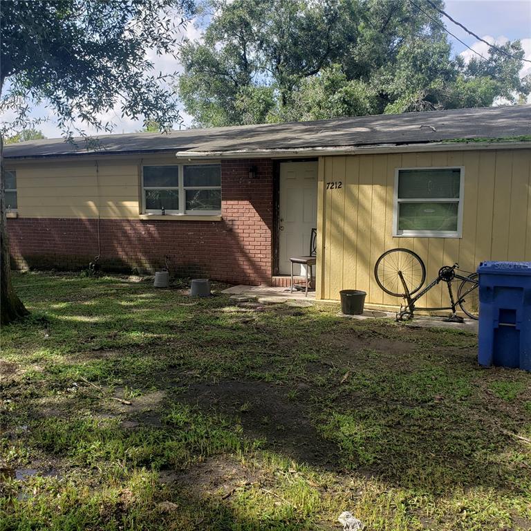 a backyard of a house with barbeque oven