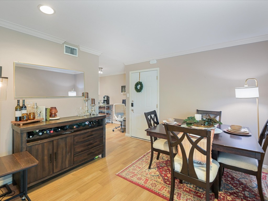 a kitchen with stainless steel appliances kitchen island granite countertop a stove a sink and a refrigerator