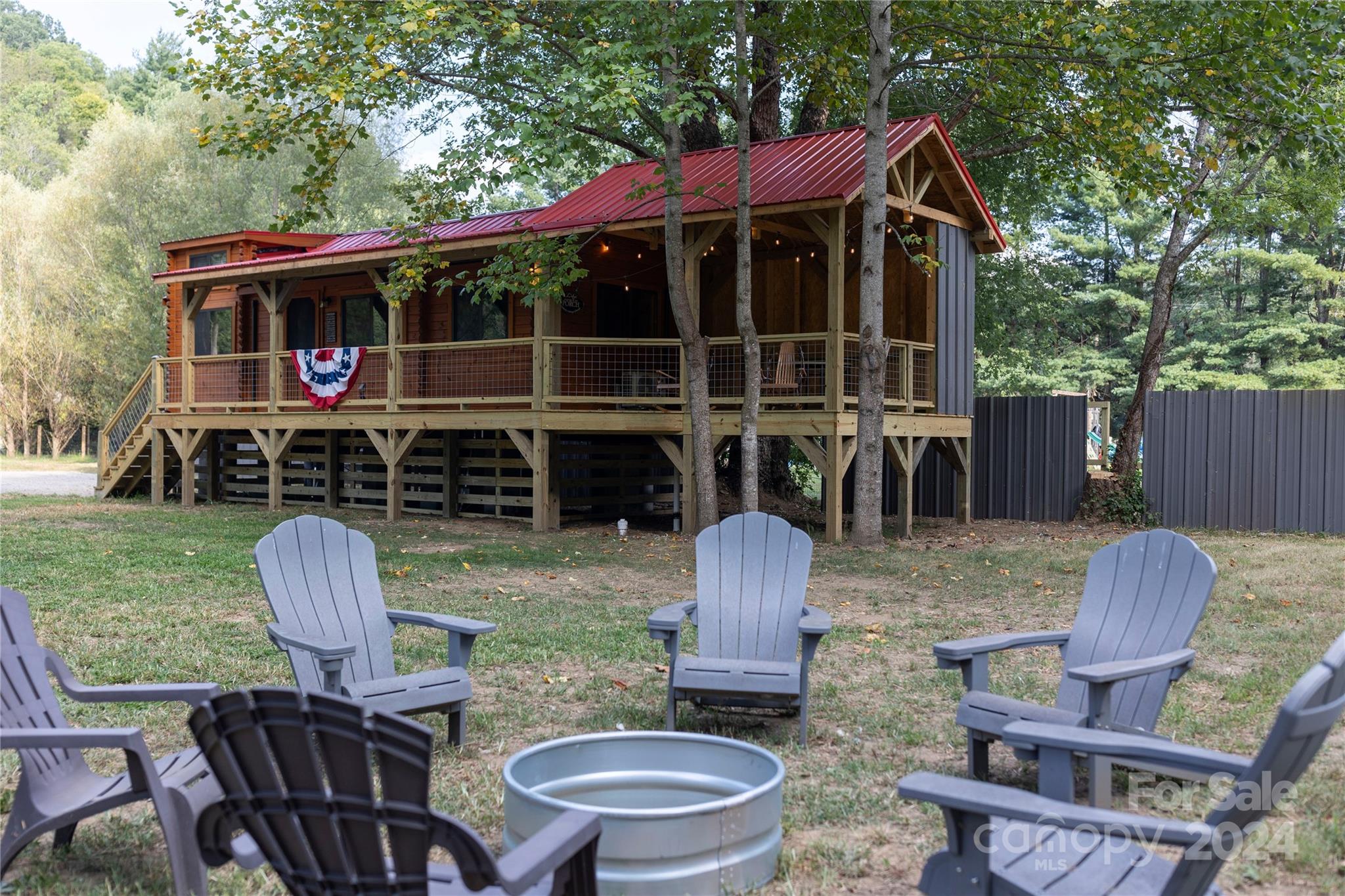 a view of house with backyard space and seating