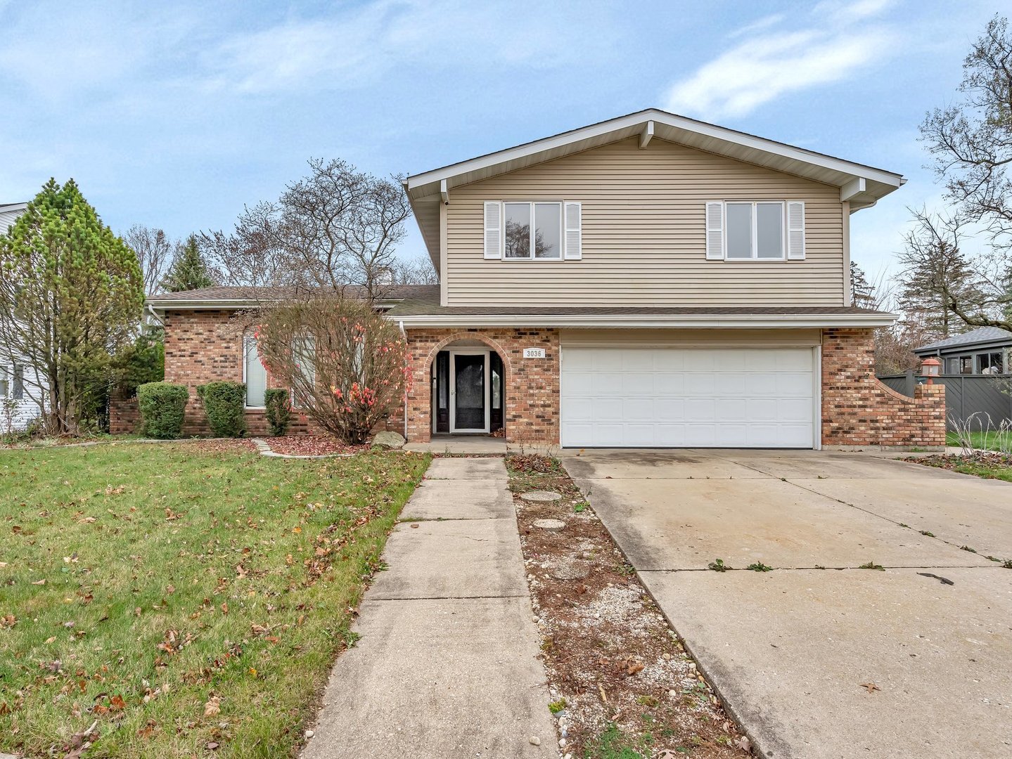 front view of a house with a yard