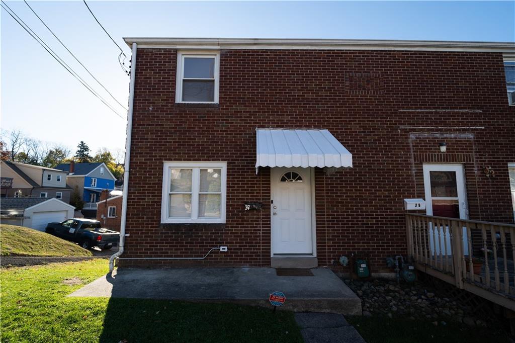 a front view of a house with yard