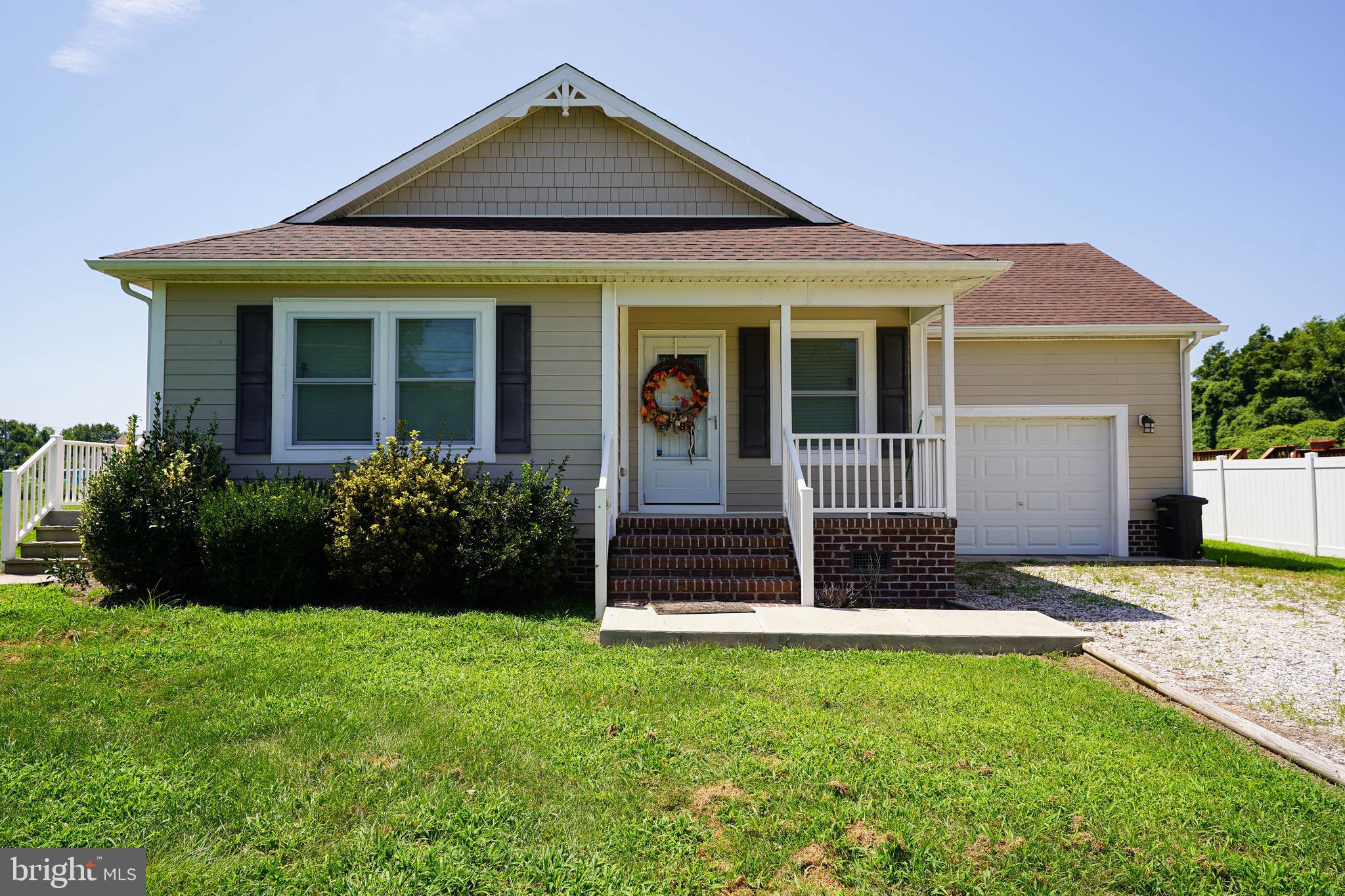 front view of a house with a yard