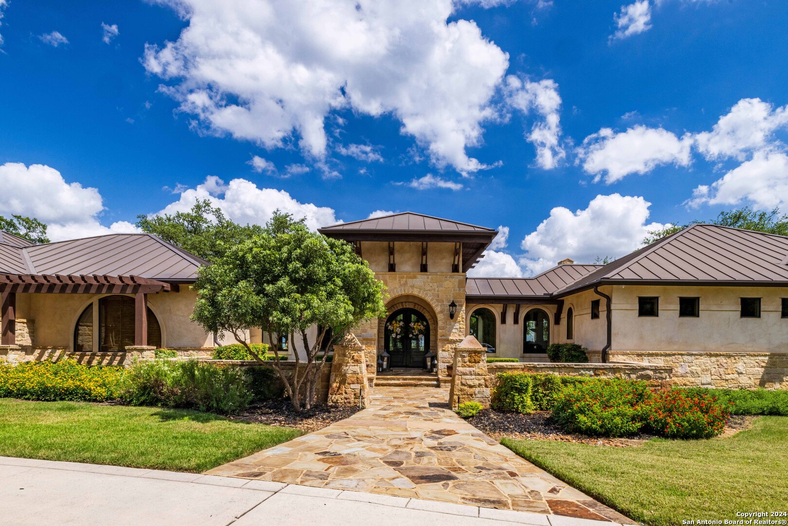 a front view of a house with garden