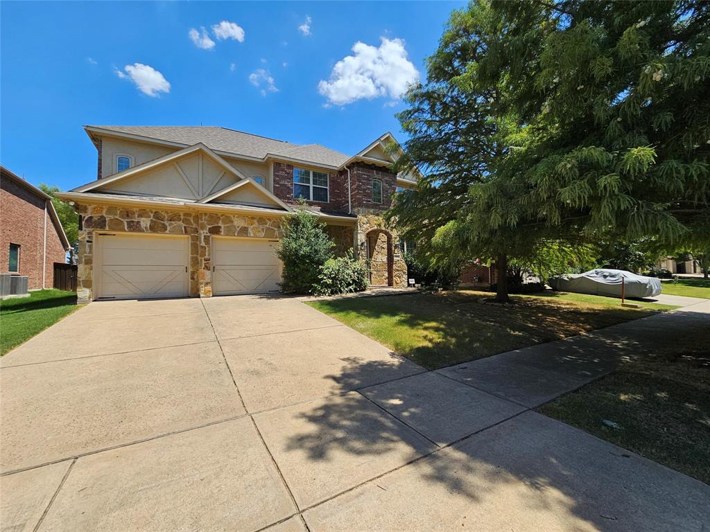 a front view of a house with yard