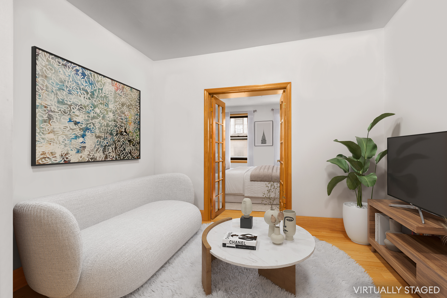 a living room with furniture potted plant and a large mirror