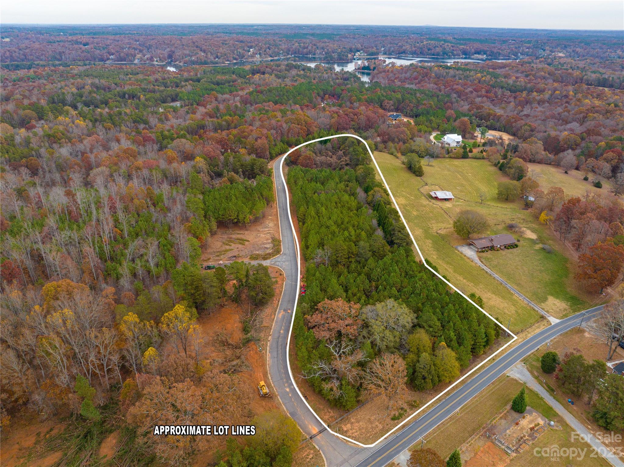 an aerial view of a residential houses with outdoor space