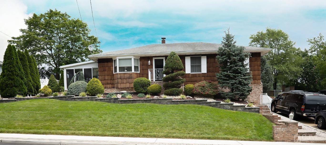 a front view of a house with a yard