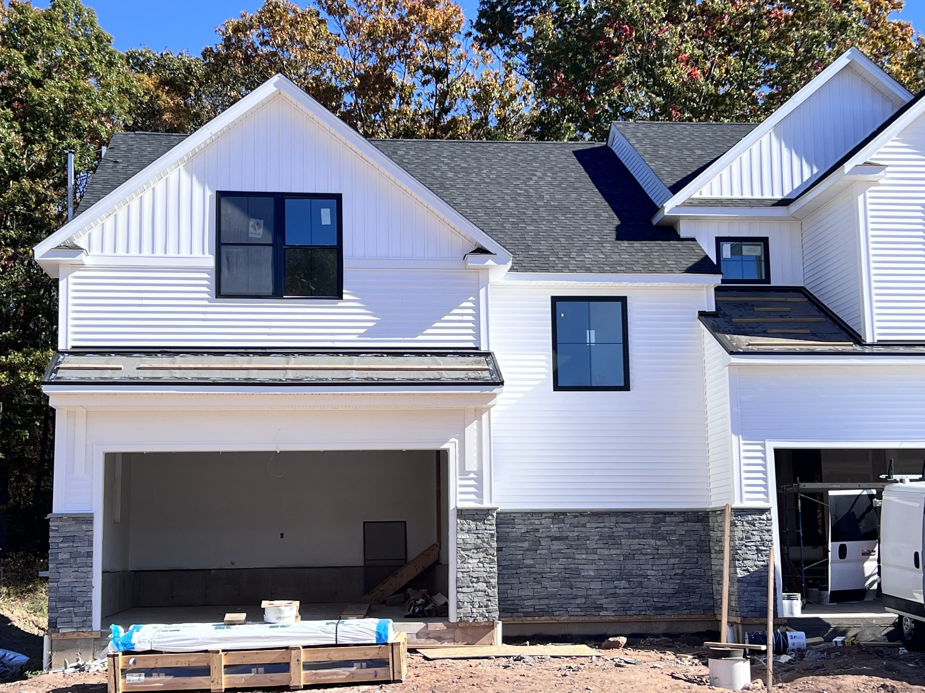 a front view of a house with garage