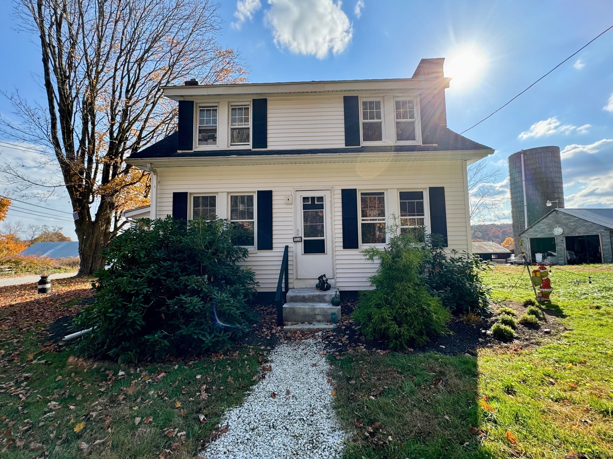 a front view of a house with garden