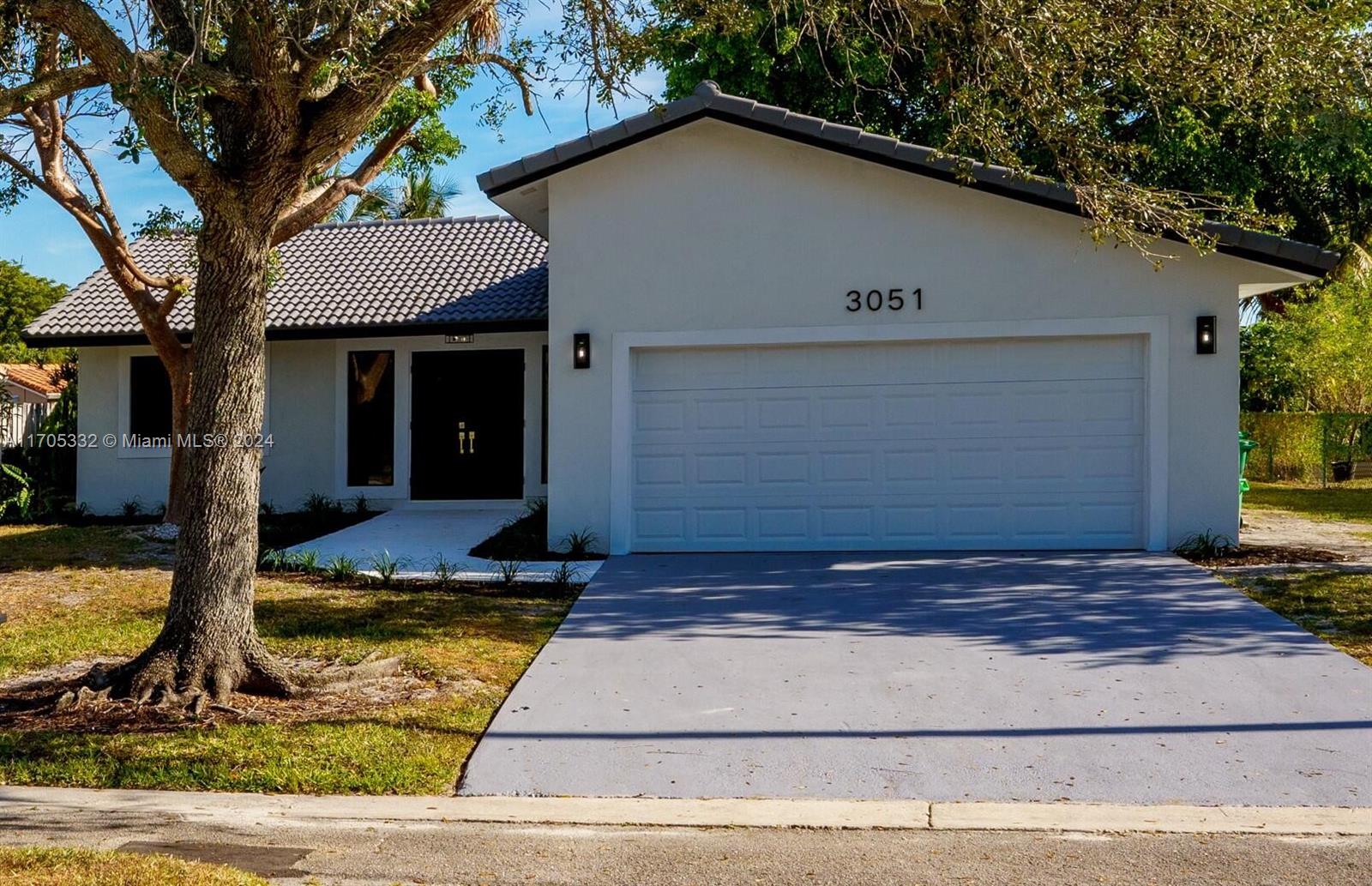 a view of house with yard