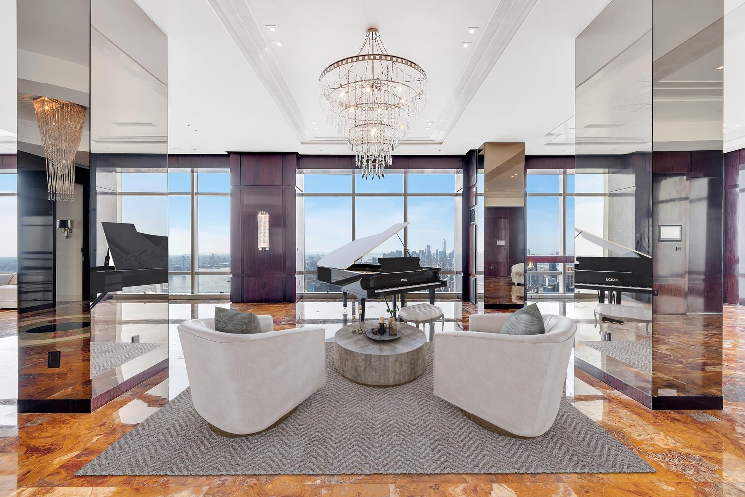 a living room with couches a table and chairs