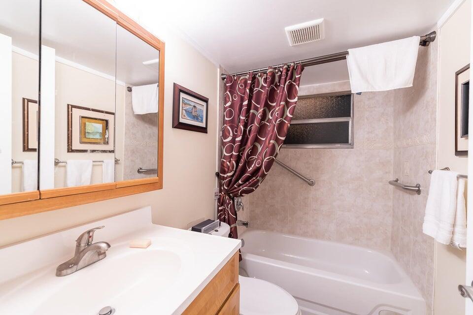 a bathroom with a bathtub and a sink