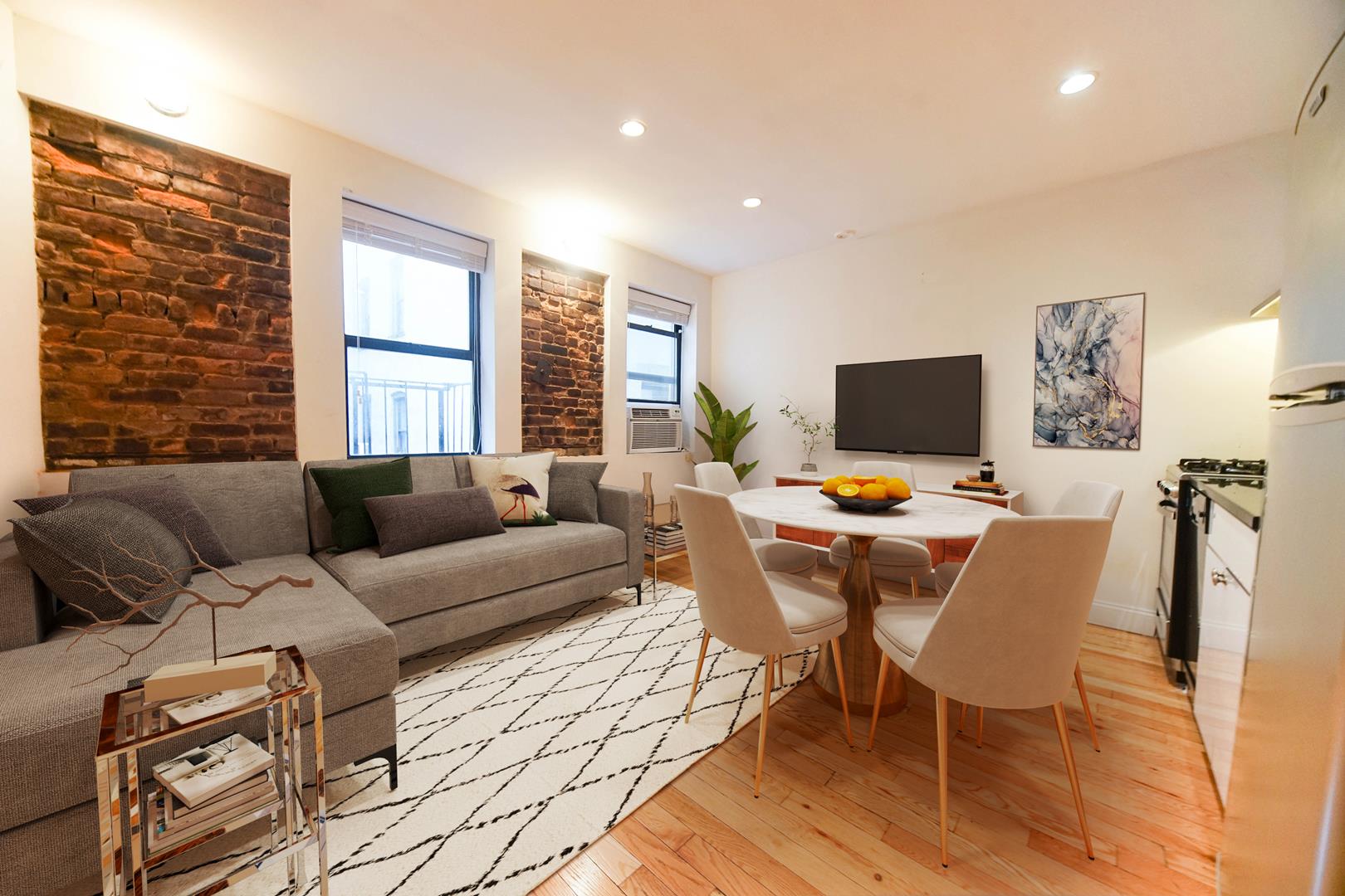 a living room with furniture a flat screen tv and a window