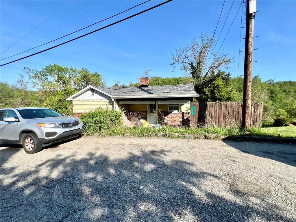 a view of a car parked in front of a house