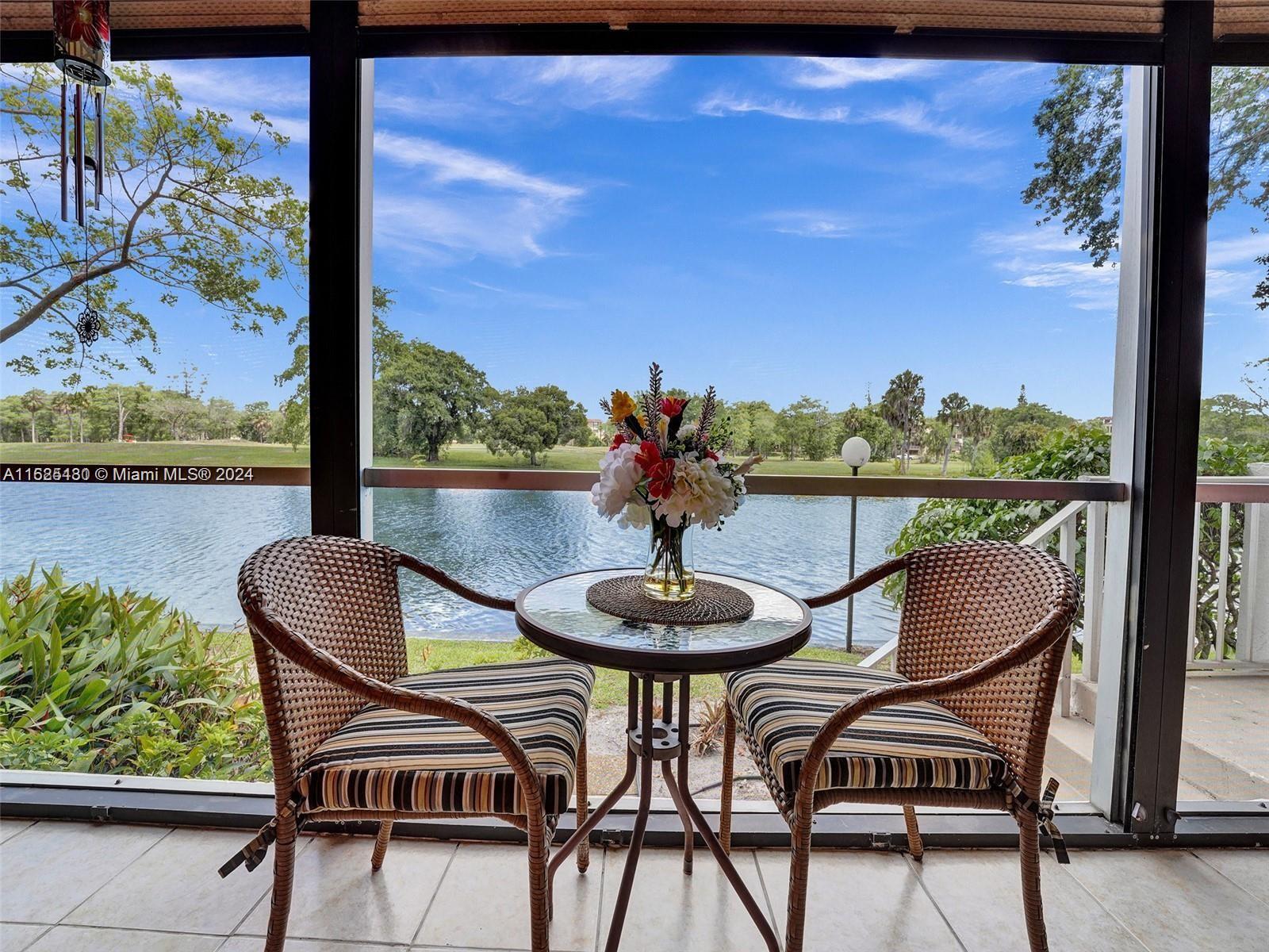 a view of a chairs and table in the patio