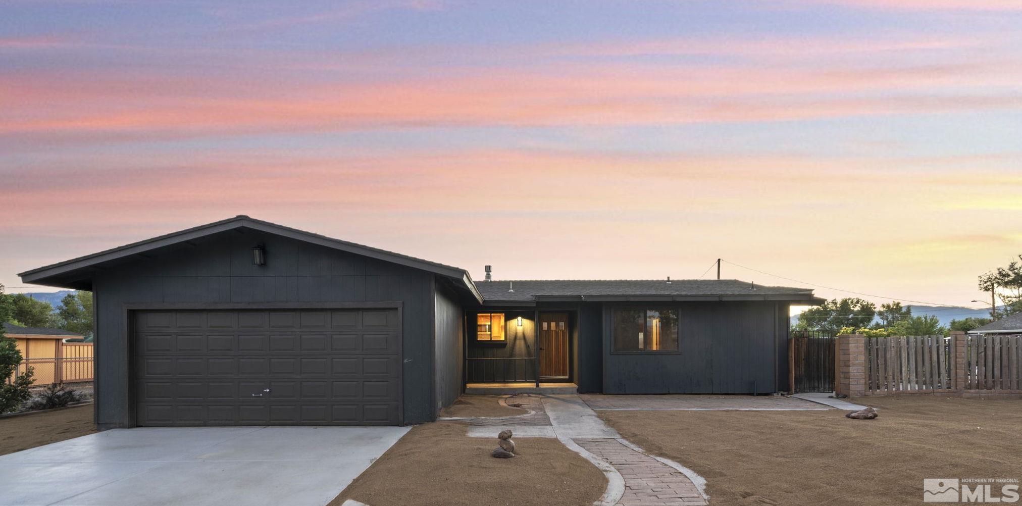 a front view of a house with a garage