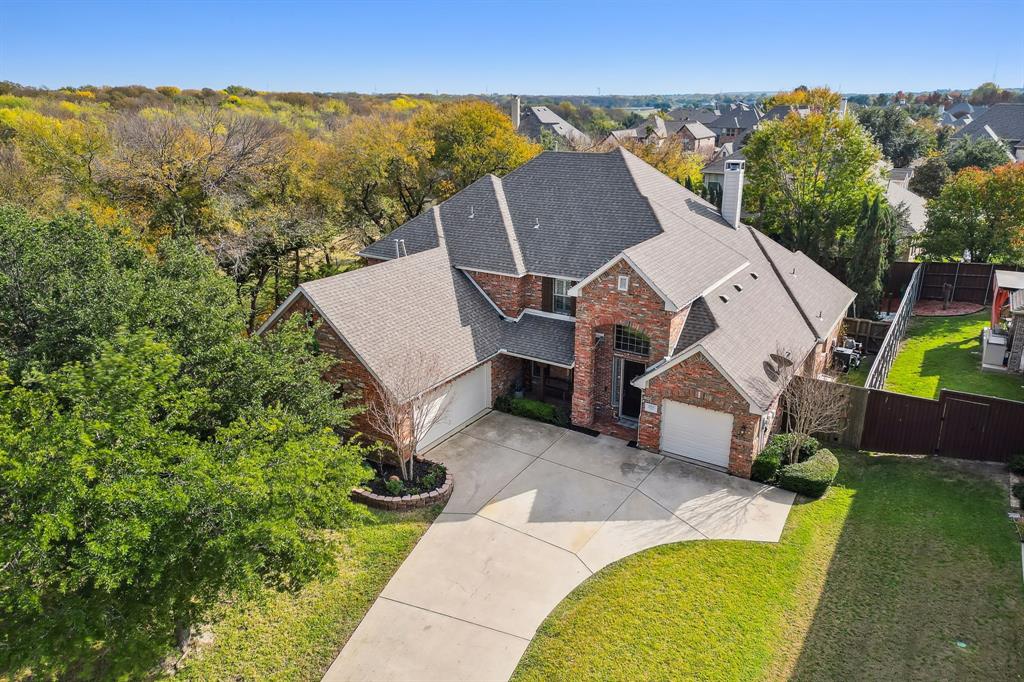 an aerial view of a house with porch