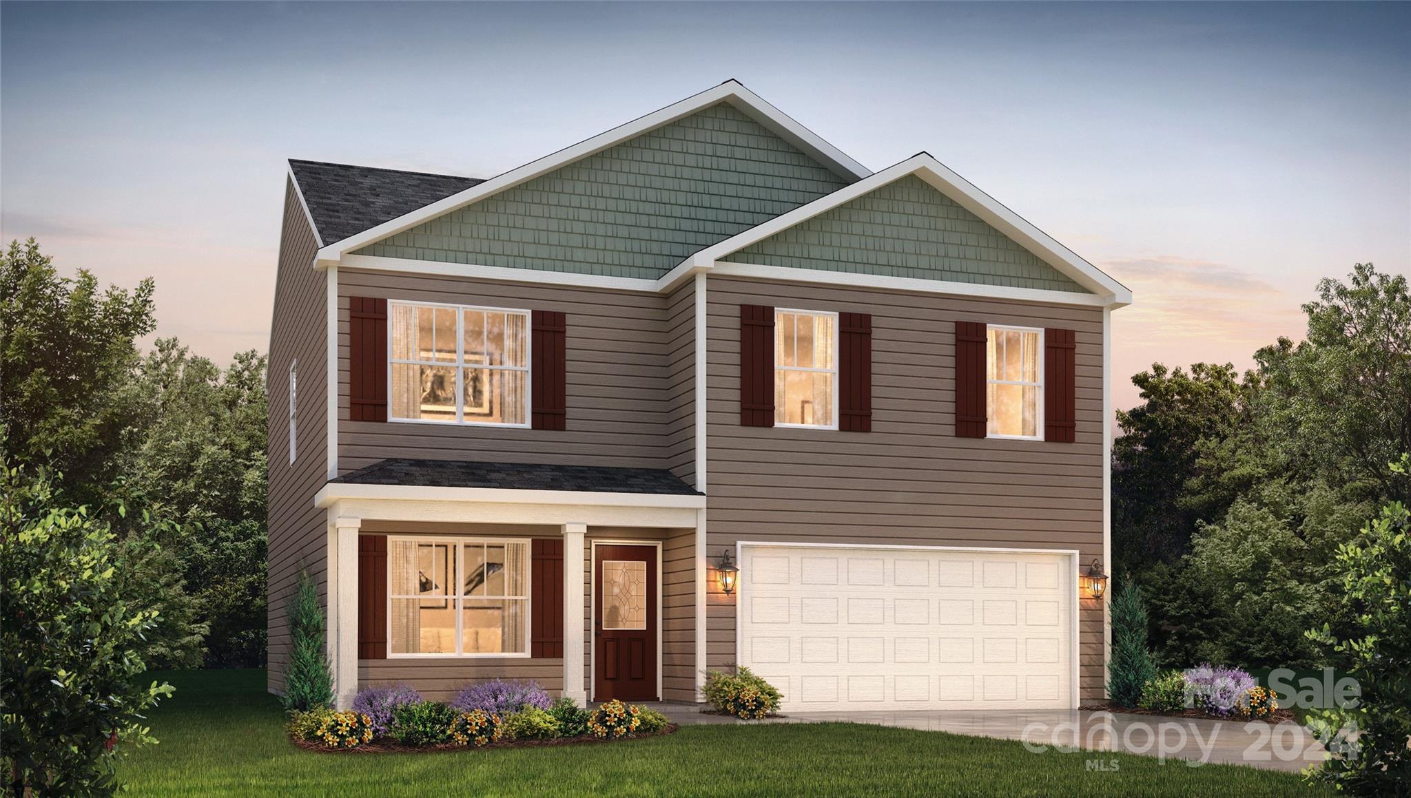 a front view of a house with a yard and garage