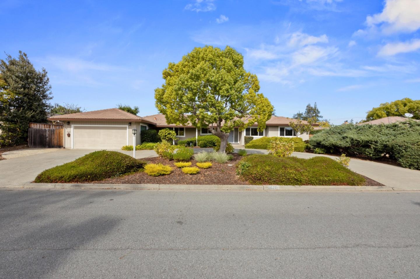 a view of a house with a yard and garage