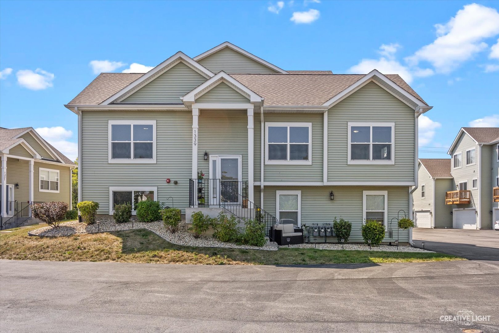 a front view of a house with a yard