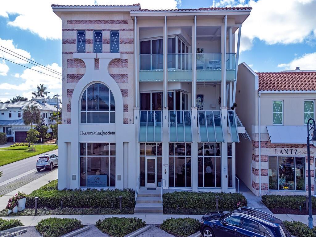 a view of a building with a yard