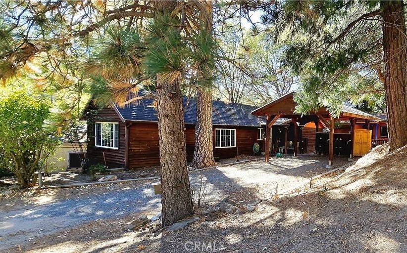 a view of a house with a tree back yard