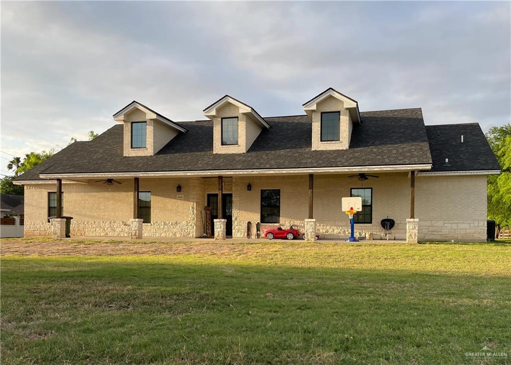 a front view of a house with a yard