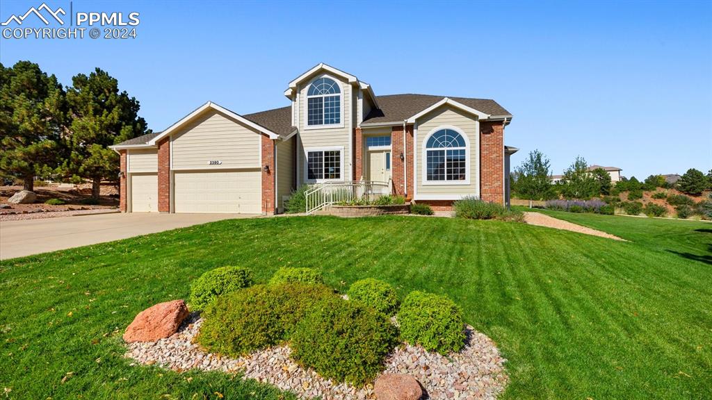 a front view of a house with yard