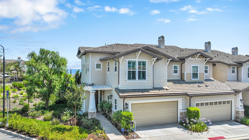 a front view of a house with a garage