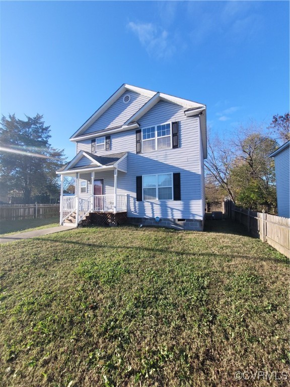 View of front of house with a porch and a front la