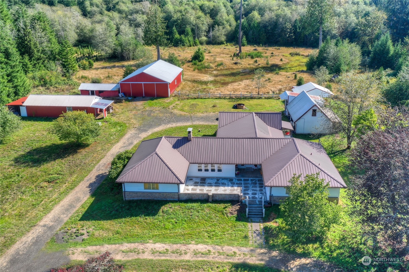 an aerial view of residential houses with yard