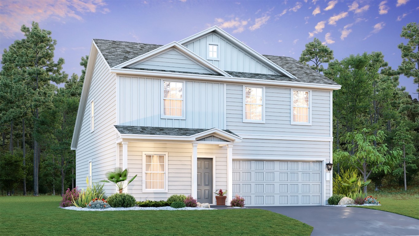 a front view of a house with a yard