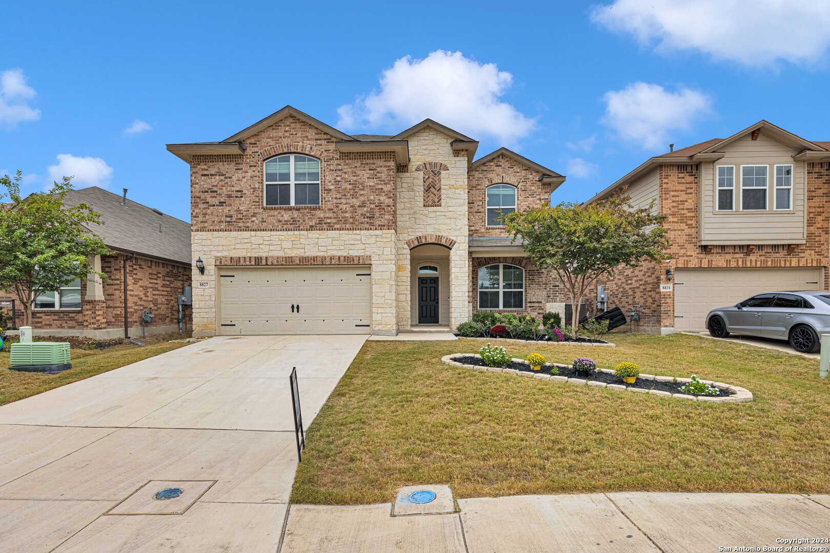 a front view of a house with a yard