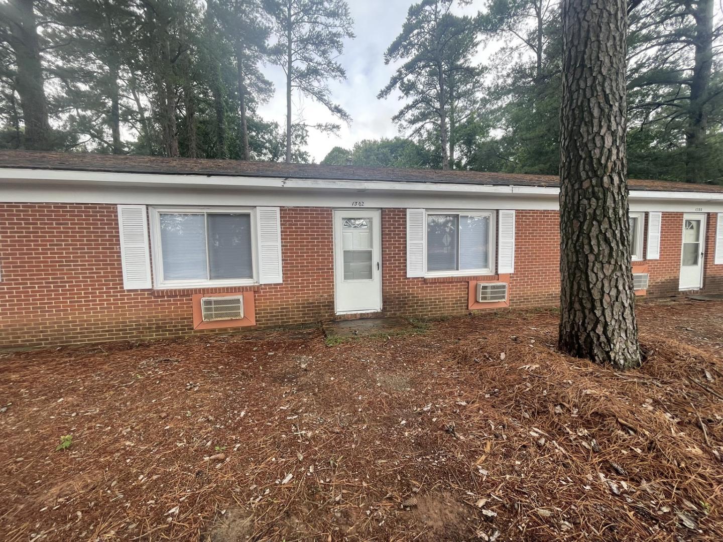 a house with trees in front of it