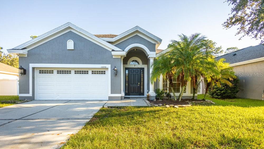 a front view of a house with a yard