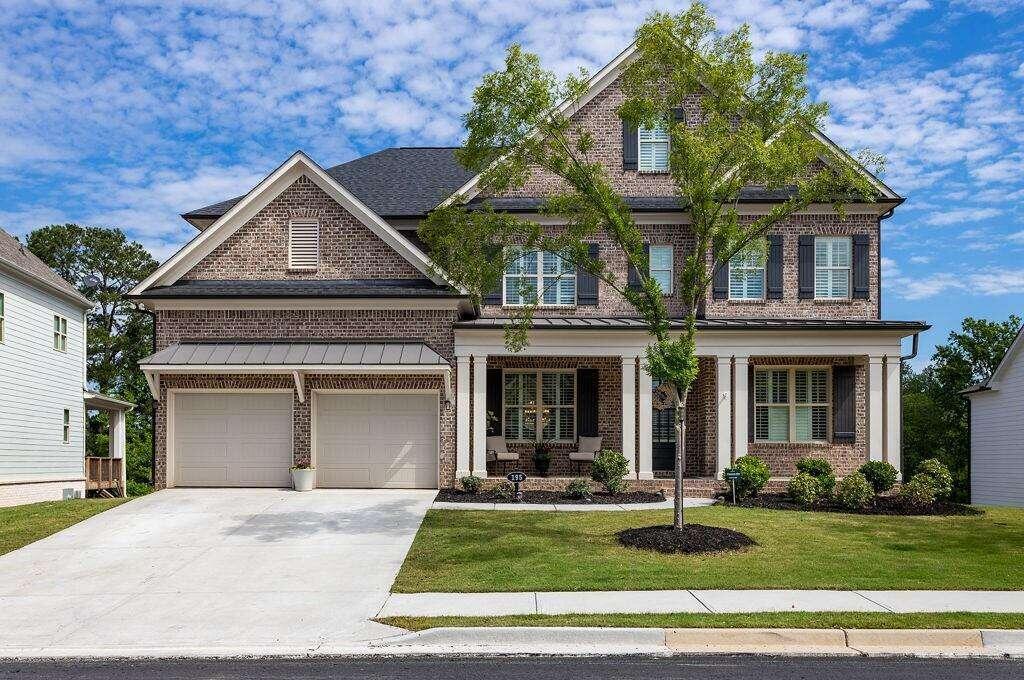 front view of a house with a yard