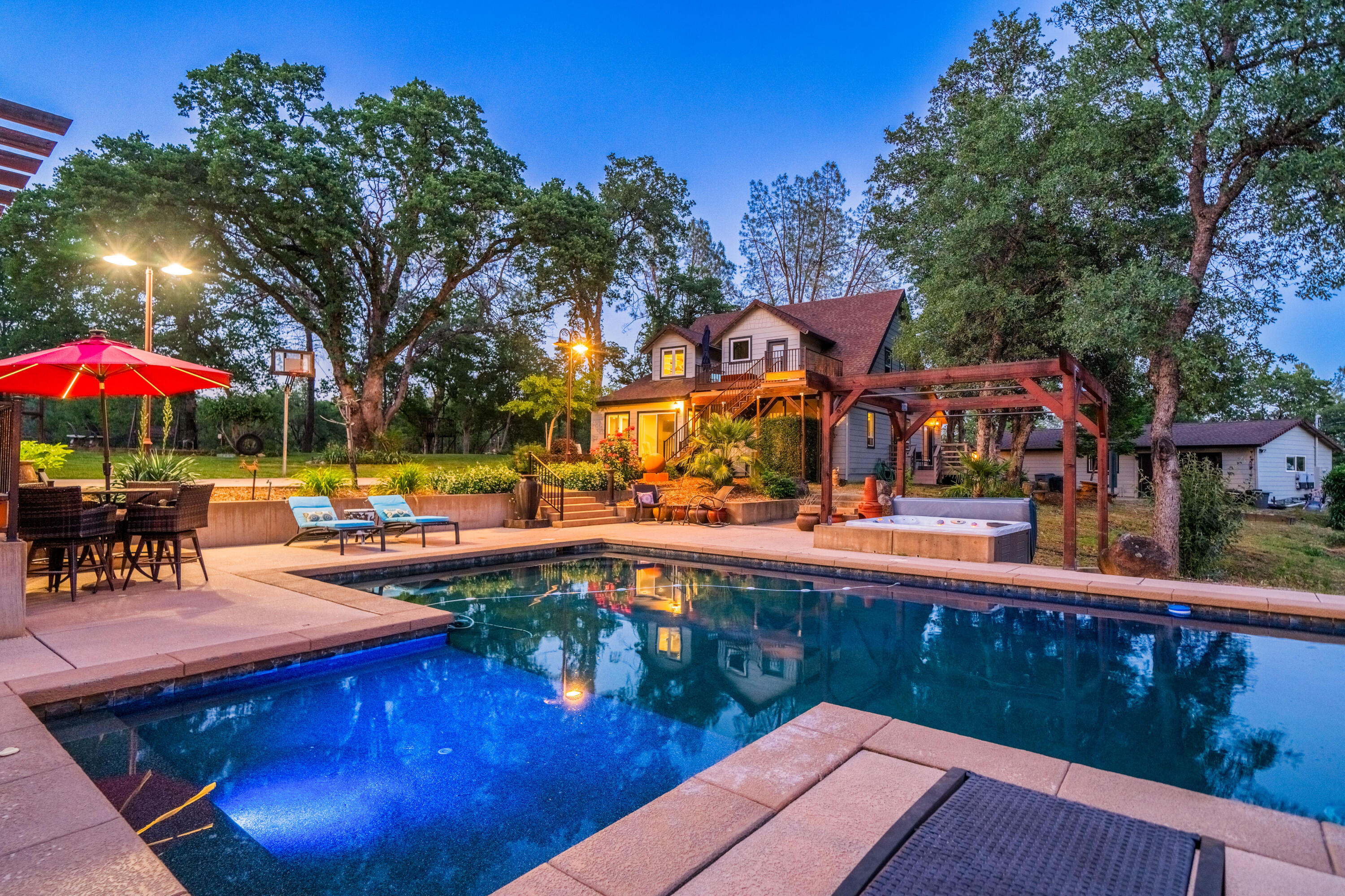 a view of a swimming pool with a table and chairs