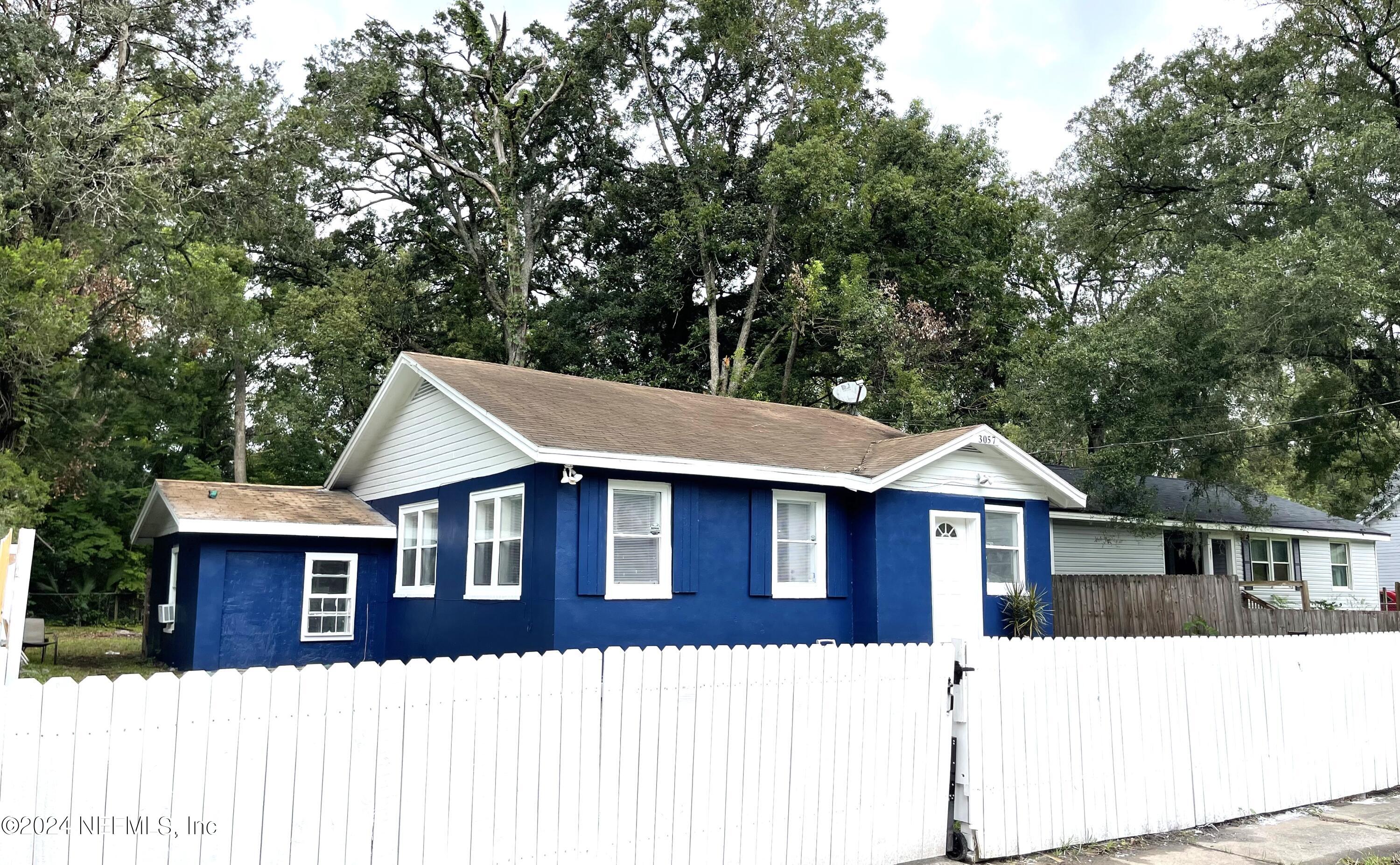 a house with trees in the background