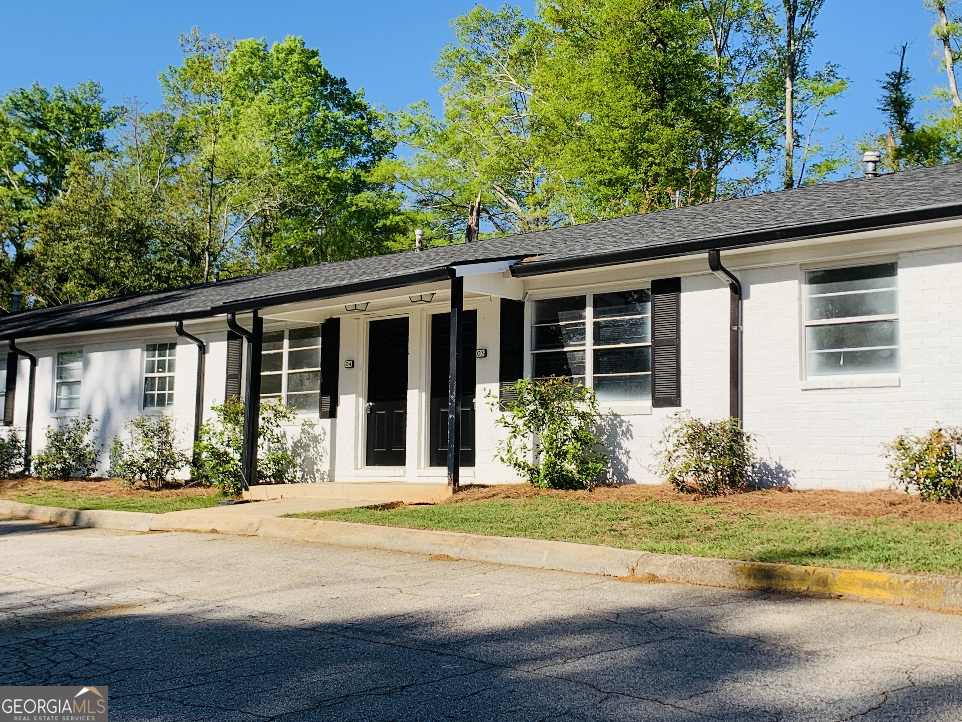 a view of a house with a garden