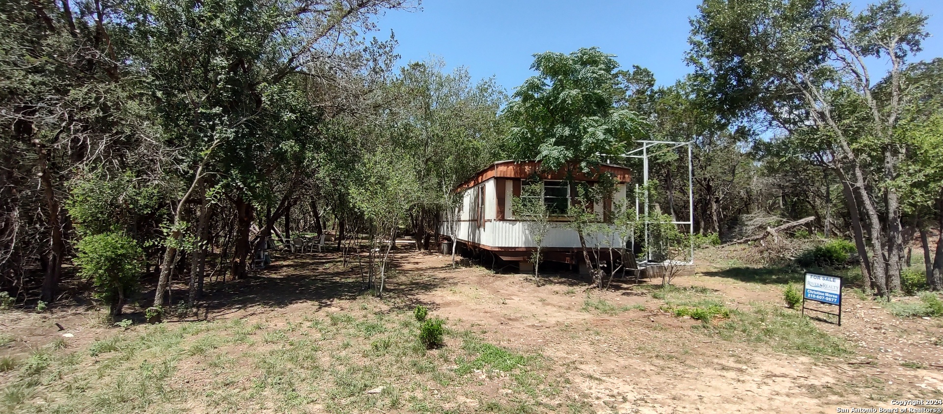 a view of house with a yard