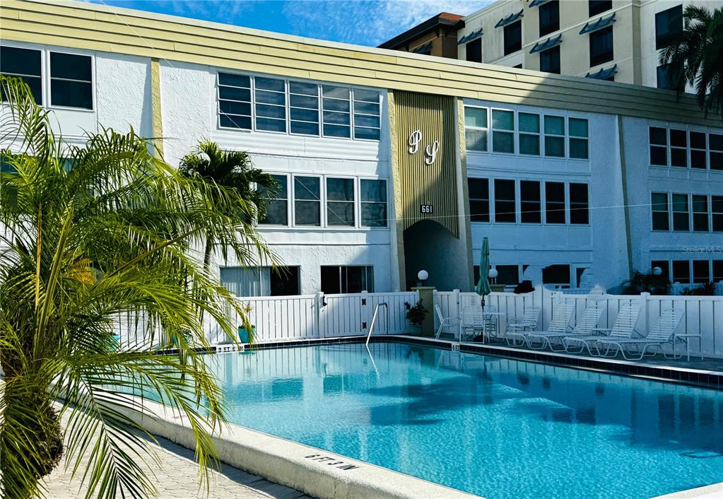 a view of pool with outdoor seating