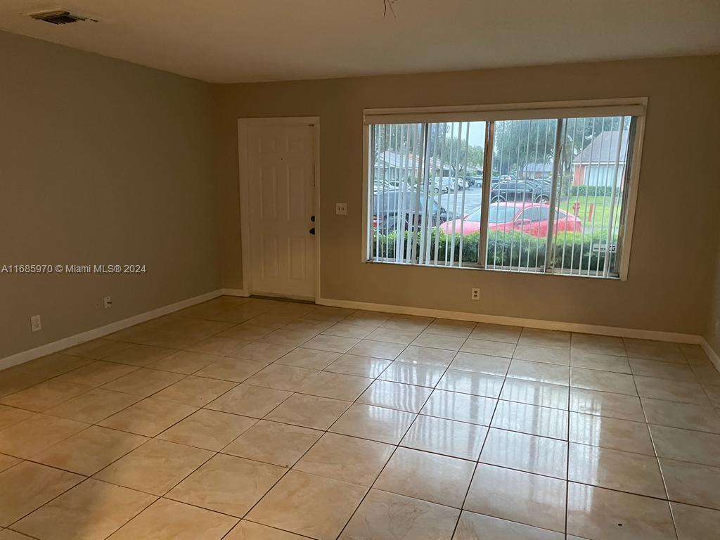 a view of an empty room and window